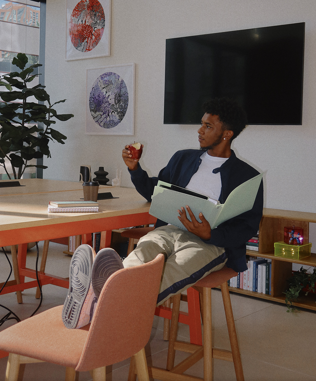 A man sitting and holding a book