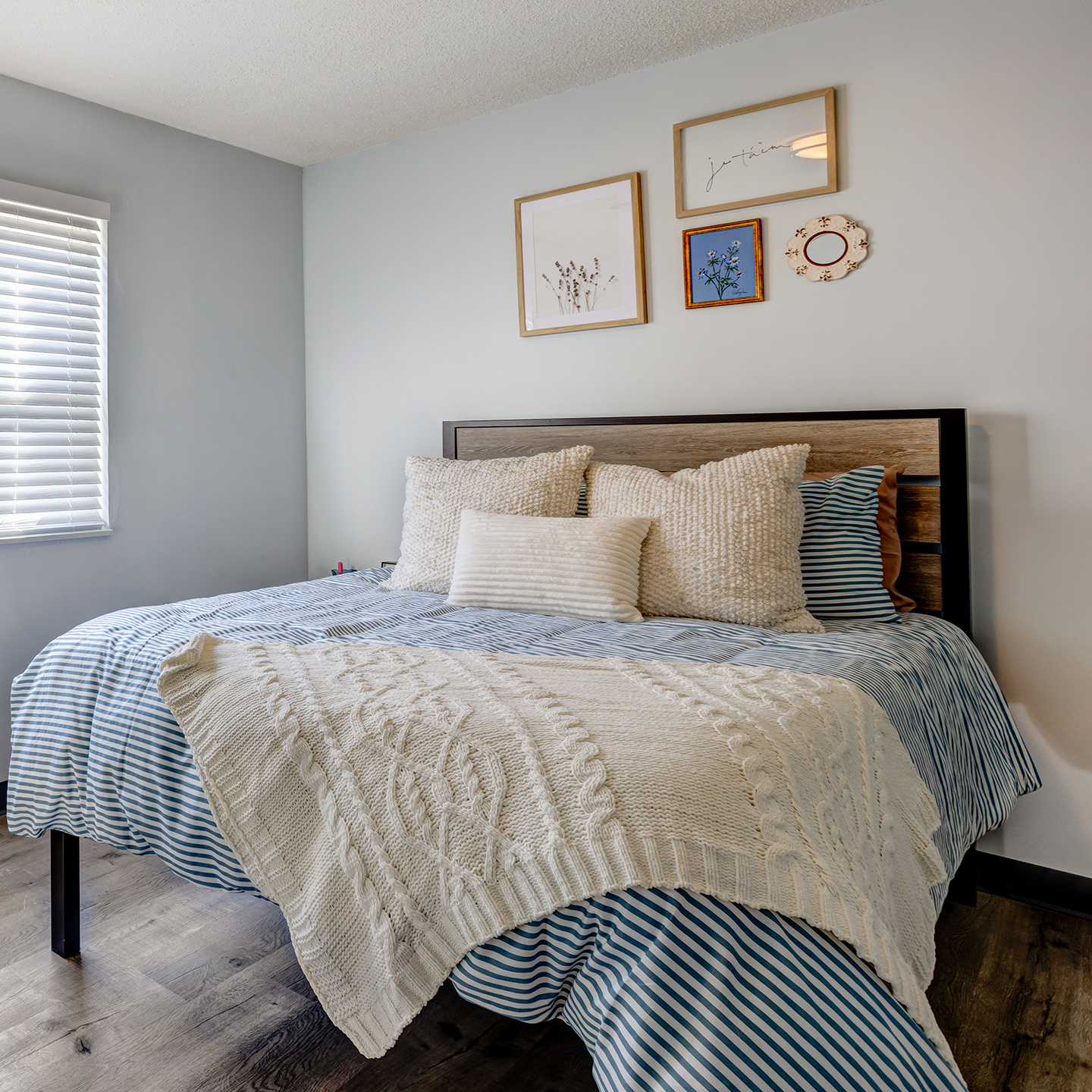 A bed with decorative pillows