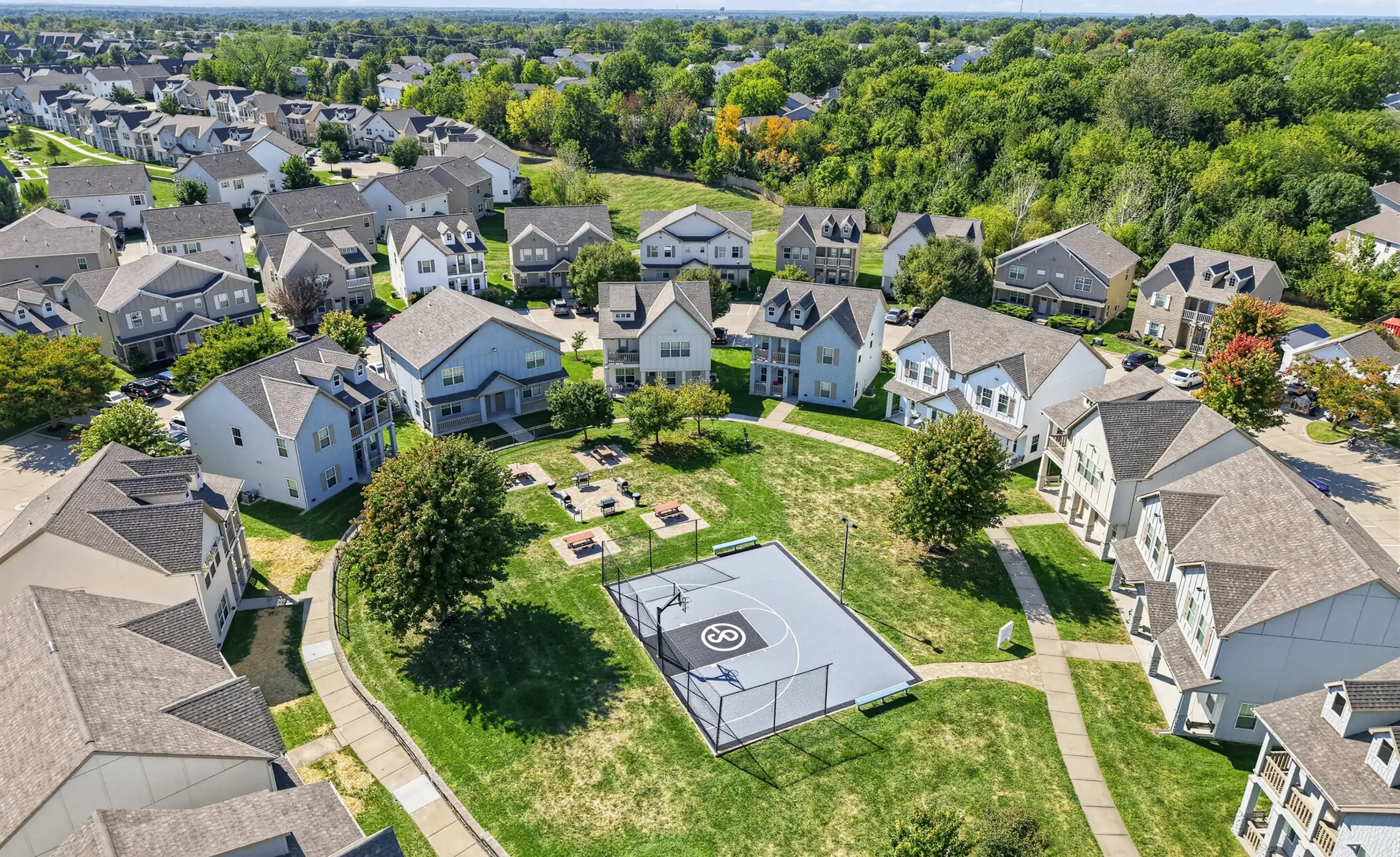 View of the community from above, showing the green spaces and basketball court