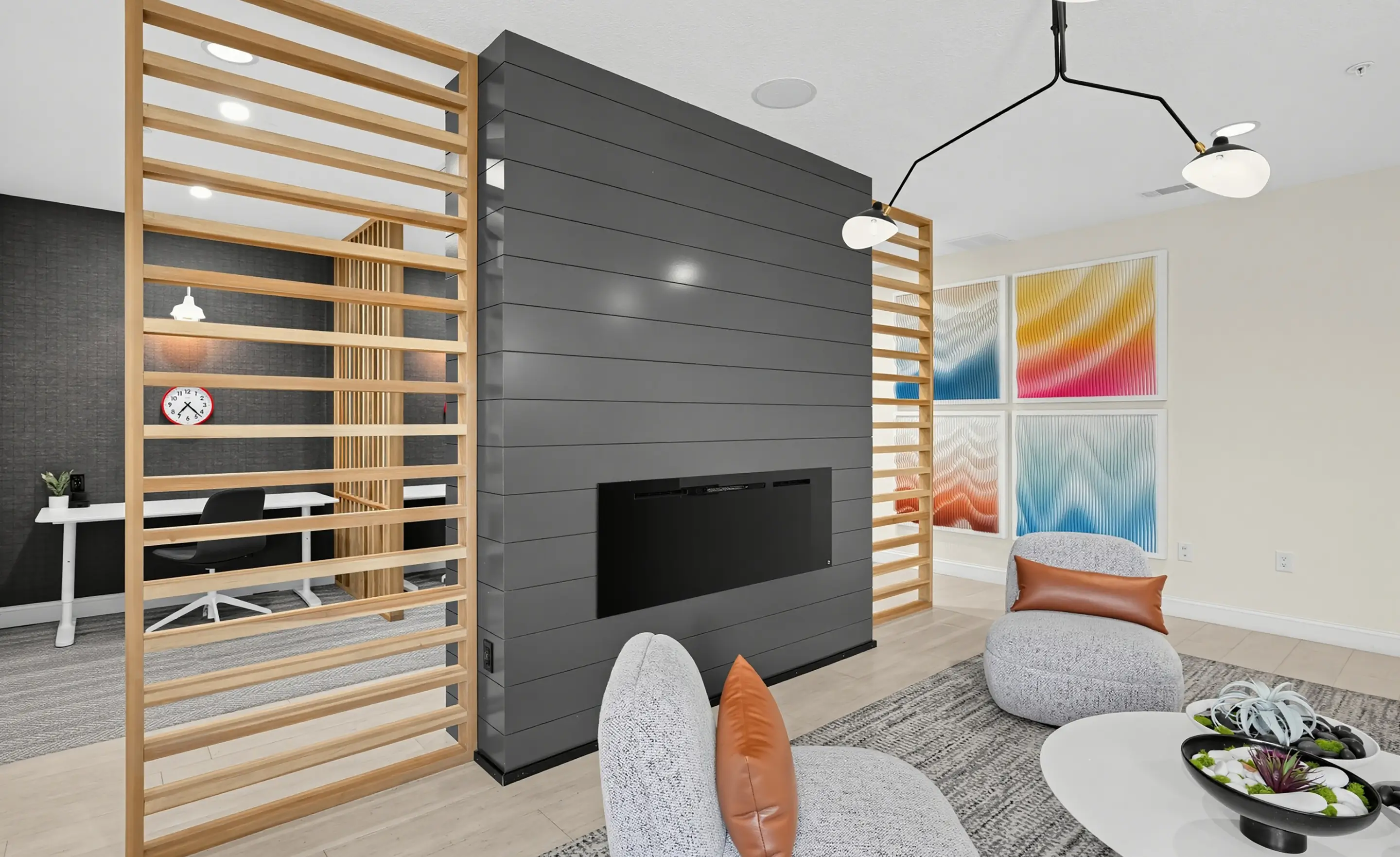 apartment lounge with couches and an electric fireplace