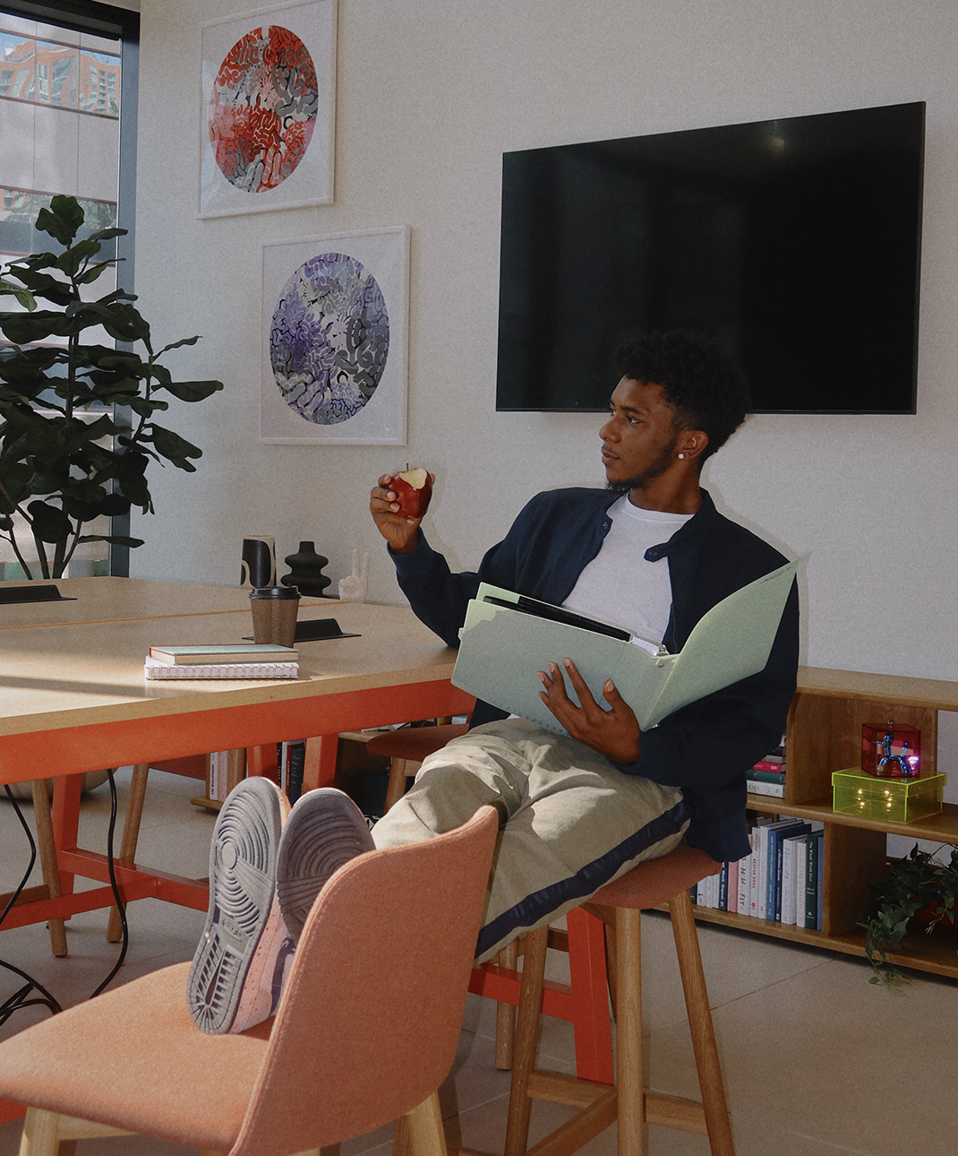 A man sitting and holding a book