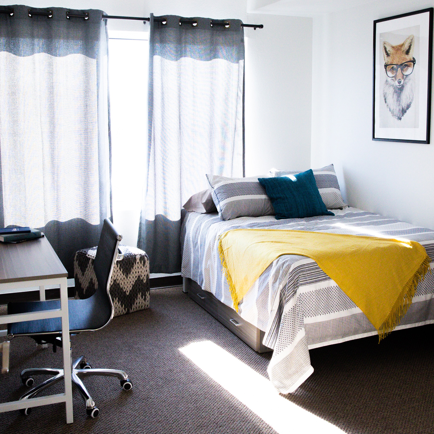 A bedroom with a study desk