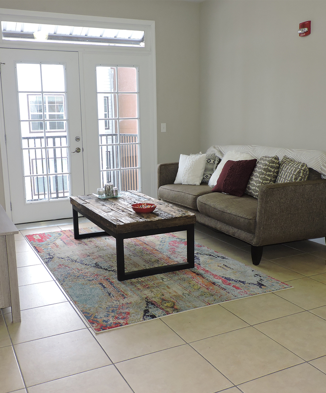 A living room with a couch and a coffee table