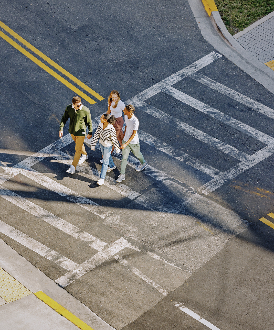 A group of friends crossing the street