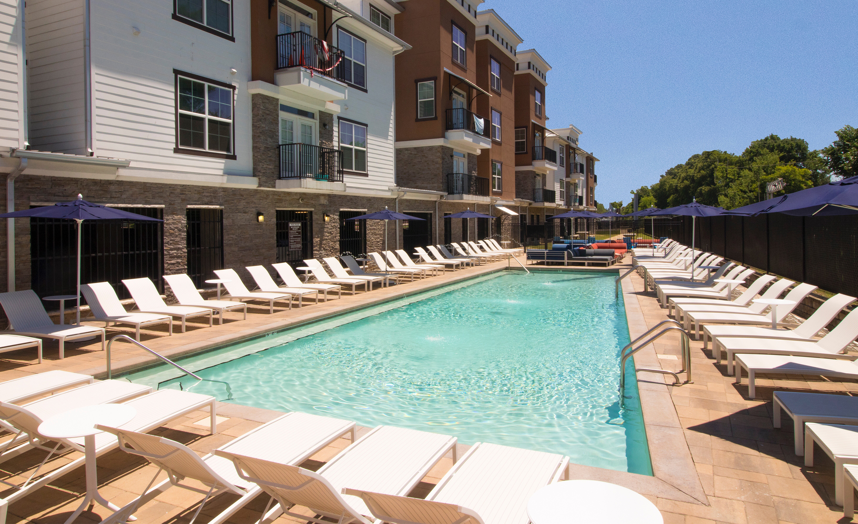 A pool next to a building